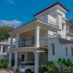 Exterior of a 2 floor villa with a terrace